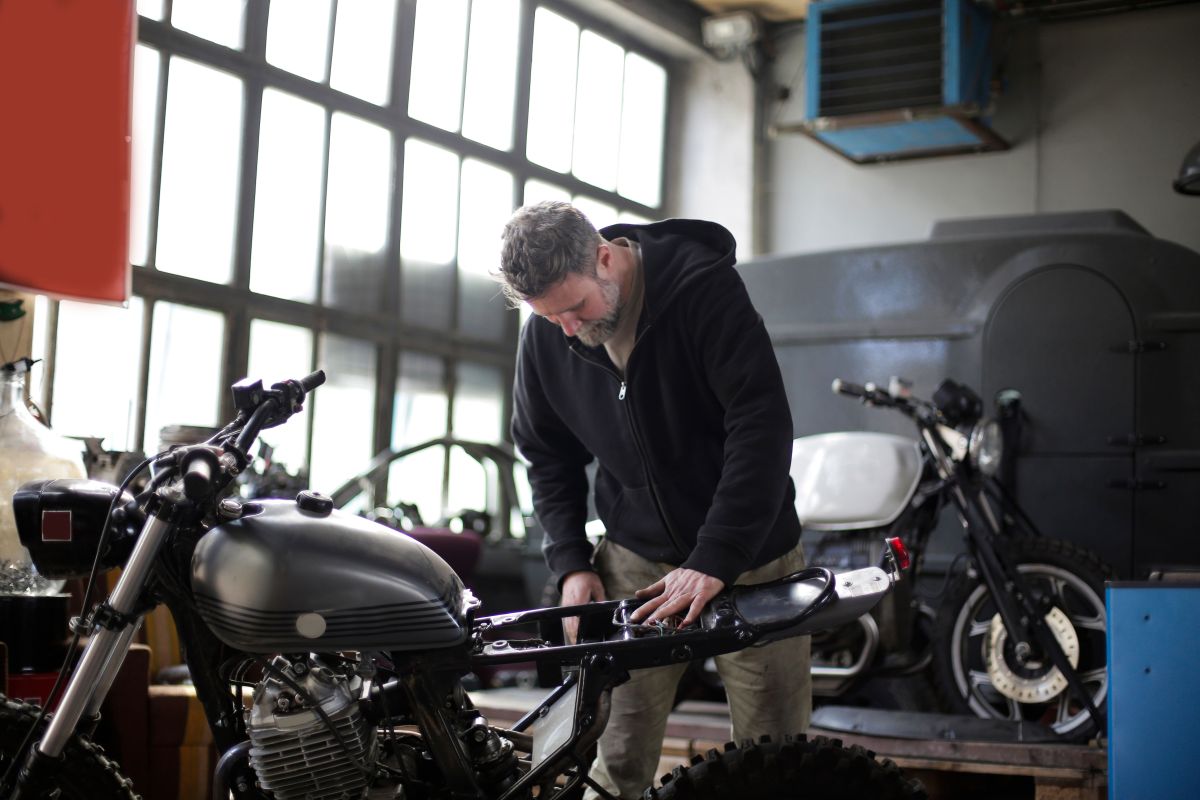 Illustration for Motorcycle Mechanic occupation by Shada Migration Services.